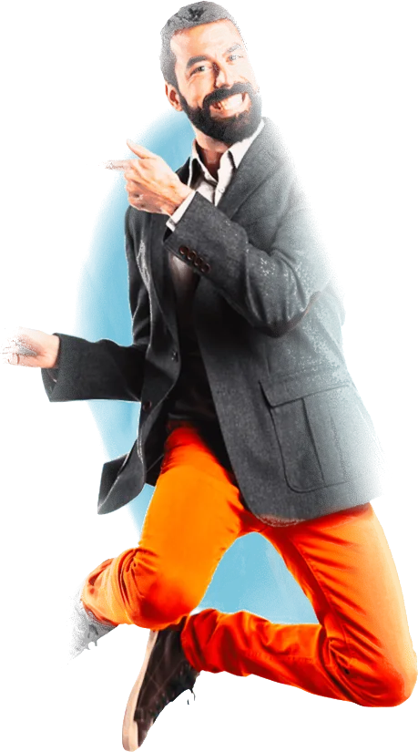 Un homme en costume et pantalon orange qui saute de joie